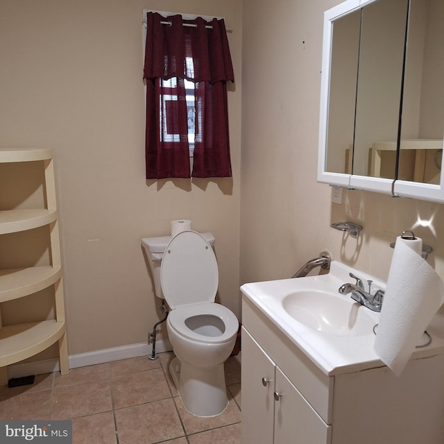 bathroom with tile patterned floors, vanity, and toilet