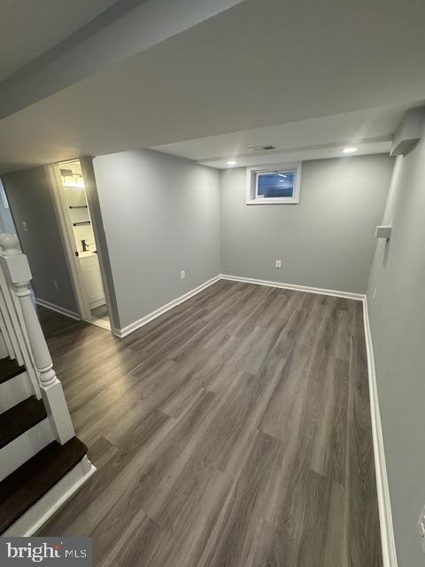 basement featuring dark hardwood / wood-style floors