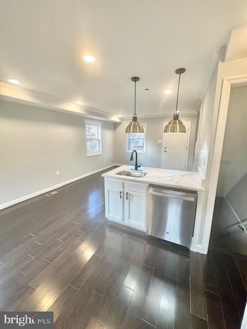 kitchen with dishwasher, pendant lighting, dark wood-type flooring, and sink