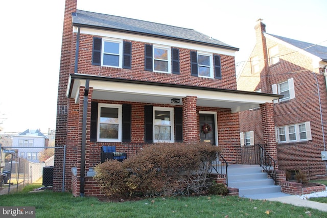 view of front of home with central air condition unit and covered porch