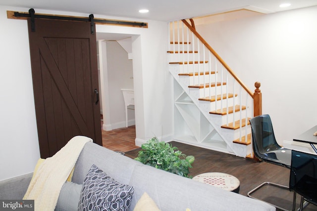 interior space featuring hardwood / wood-style flooring and a barn door