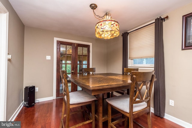 dining room with dark wood-type flooring