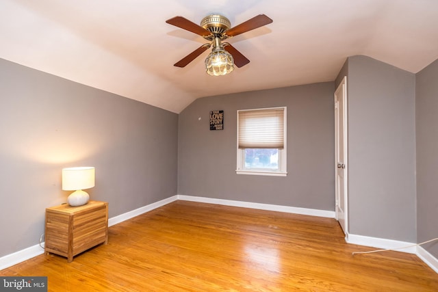 bonus room with ceiling fan, light hardwood / wood-style floors, and vaulted ceiling