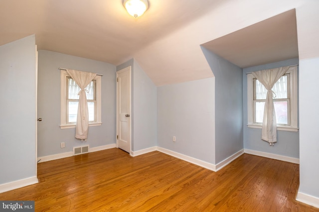 bonus room featuring hardwood / wood-style floors