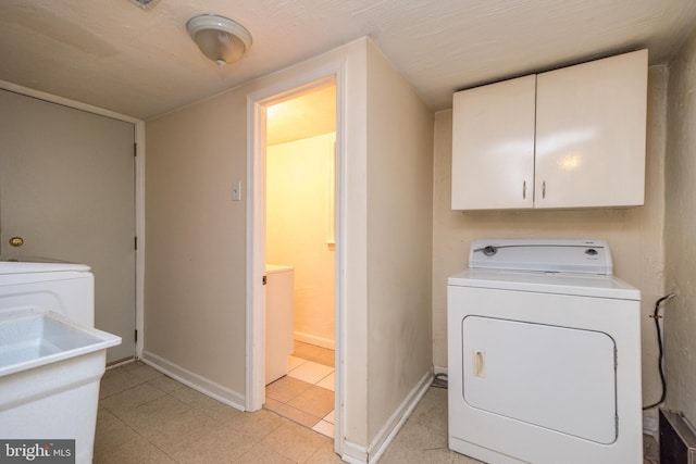 laundry room with cabinets