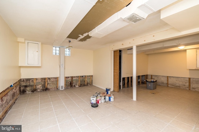 basement featuring light tile patterned floors