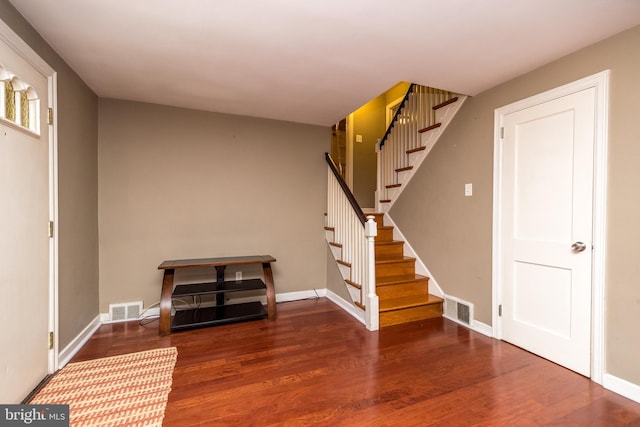 basement with dark hardwood / wood-style floors