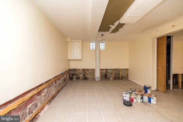 basement featuring light tile patterned floors