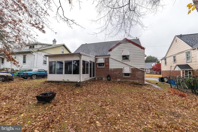 back of house with a sunroom