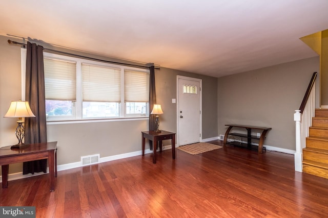 foyer with dark hardwood / wood-style flooring