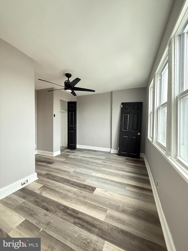 interior space with light wood-type flooring and ceiling fan