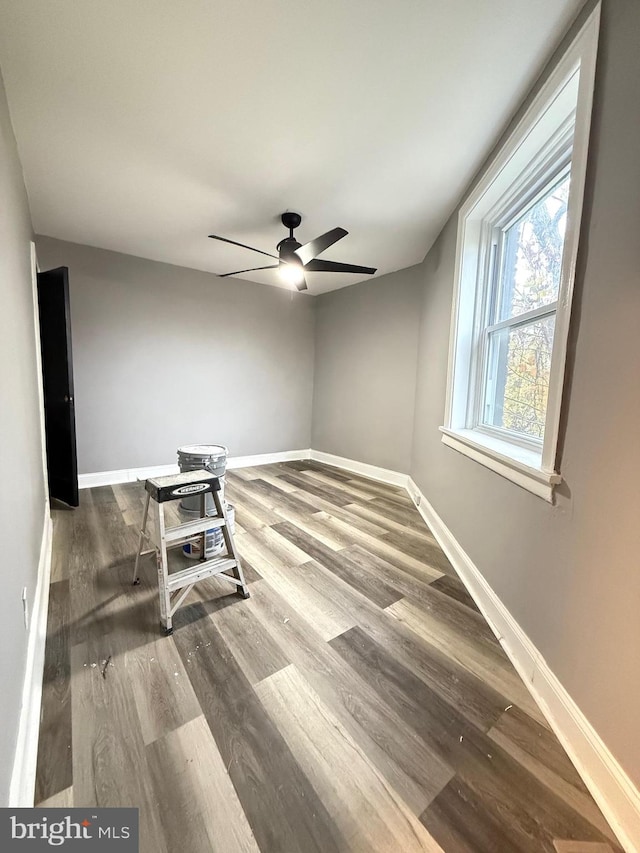 unfurnished room featuring ceiling fan and hardwood / wood-style flooring