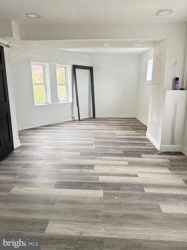 spare room with hardwood / wood-style flooring