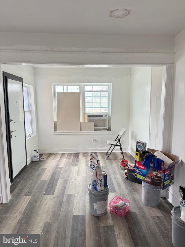 empty room with cooling unit and wood-type flooring