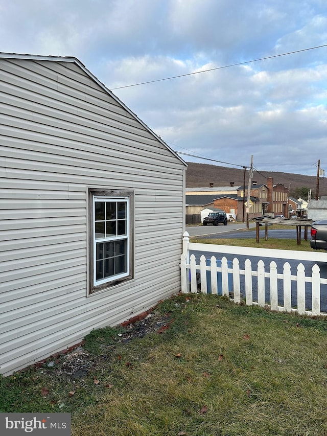 view of home's exterior featuring a yard