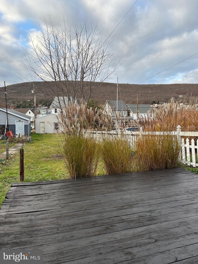 wooden deck with a yard