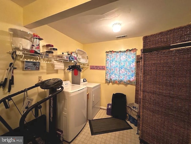 clothes washing area with independent washer and dryer