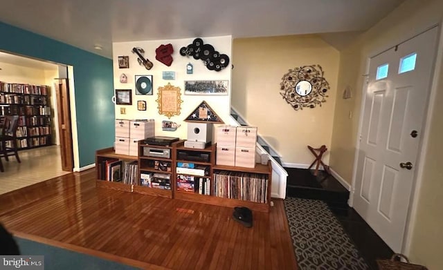 miscellaneous room featuring dark wood-type flooring