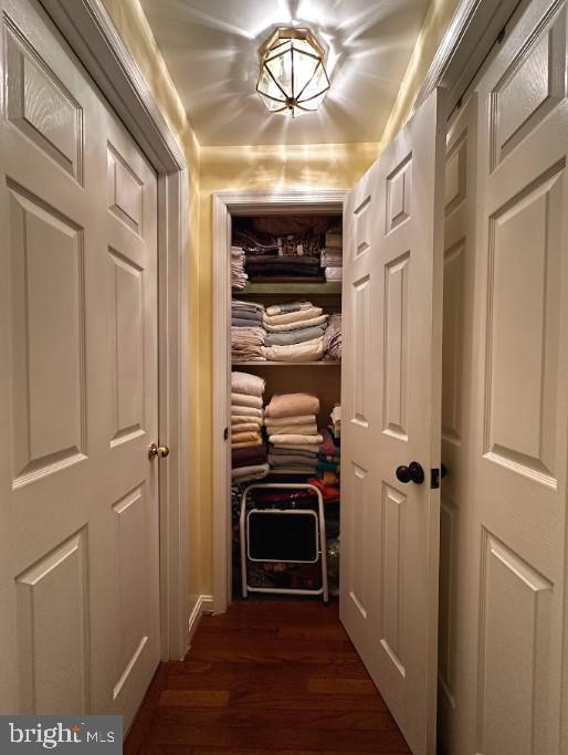 hall with dark hardwood / wood-style floors