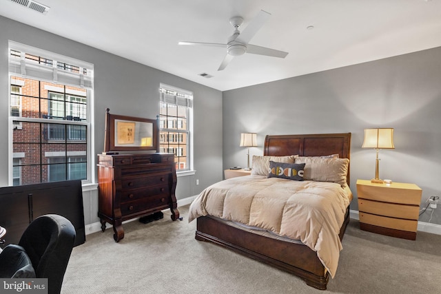 bedroom with ceiling fan and light colored carpet