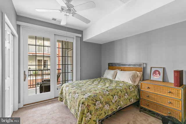 carpeted bedroom featuring access to exterior and ceiling fan