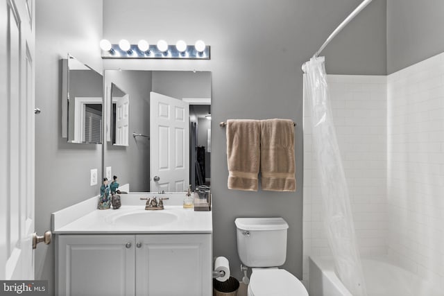 full bathroom featuring vanity, shower / bath combination with curtain, and toilet