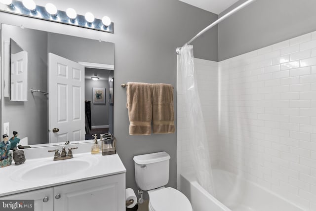 full bathroom featuring vanity, toilet, and shower / bath combo with shower curtain