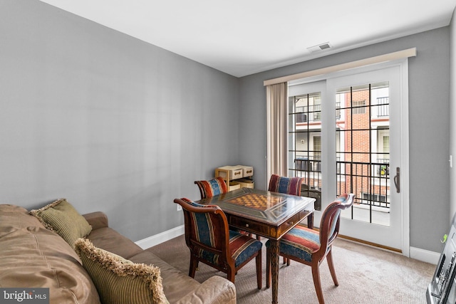 dining space with carpet flooring