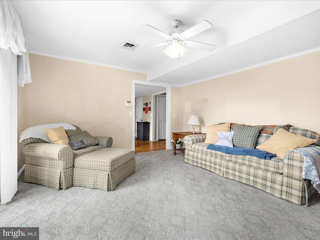 living room with crown molding, carpet, and ceiling fan