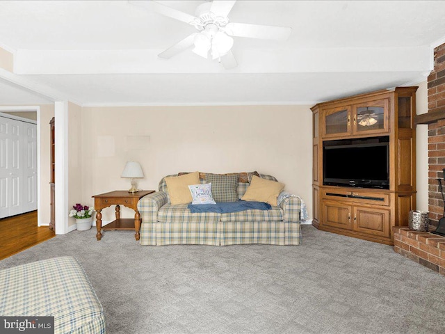 carpeted bedroom with ceiling fan and a closet