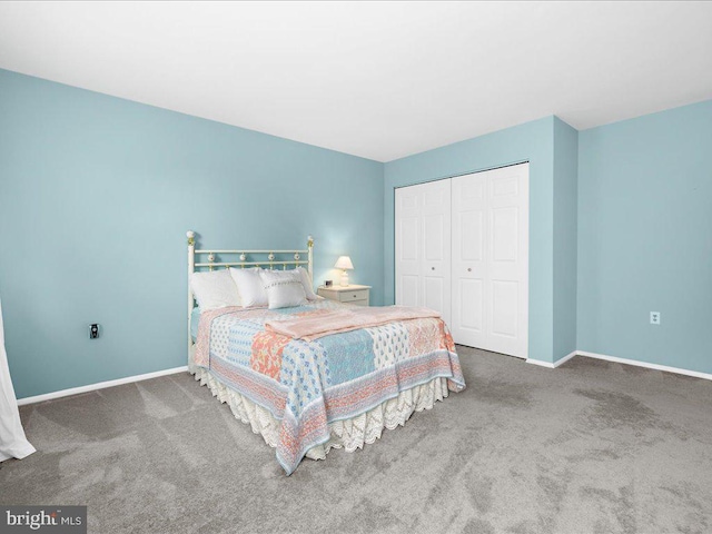 carpeted bedroom featuring a closet