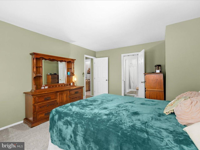 bedroom with light colored carpet