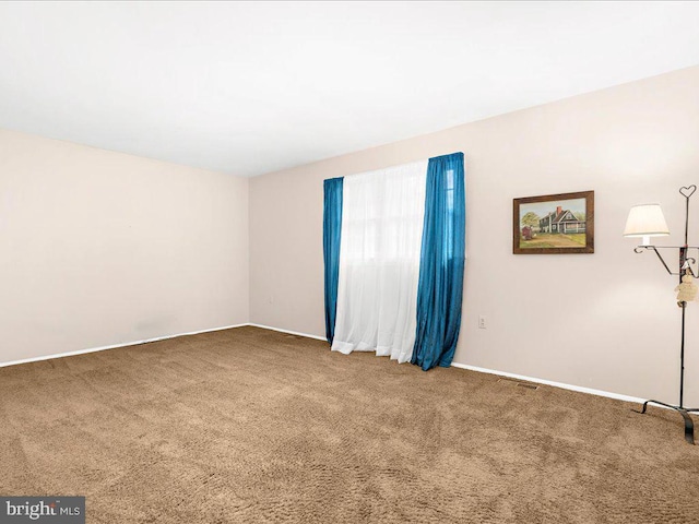 view of carpeted spare room