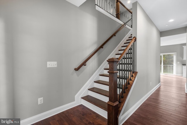 stairway featuring hardwood / wood-style flooring