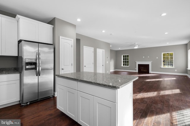 kitchen featuring white cabinetry, stainless steel fridge, dark hardwood / wood-style flooring, and ceiling fan