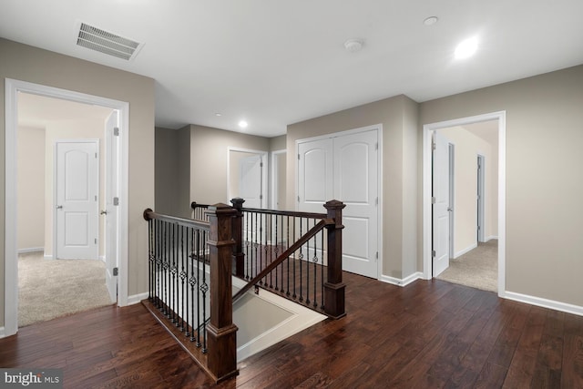 hallway featuring dark hardwood / wood-style flooring