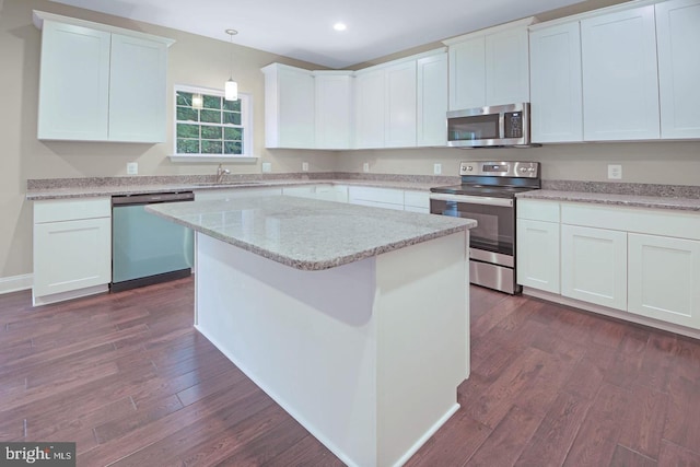 kitchen with white cabinetry, dark hardwood / wood-style flooring, and stainless steel appliances