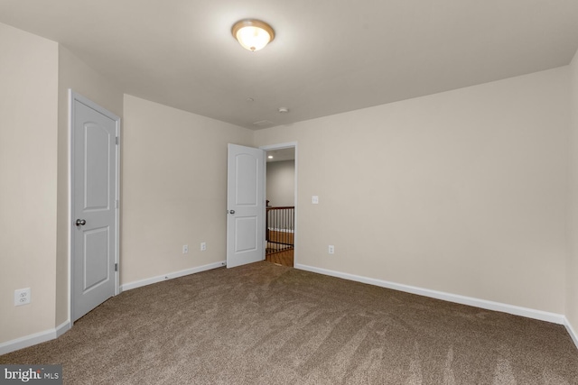 unfurnished bedroom featuring carpet