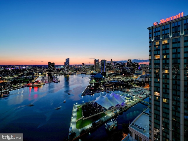 aerial view at dusk with a water view