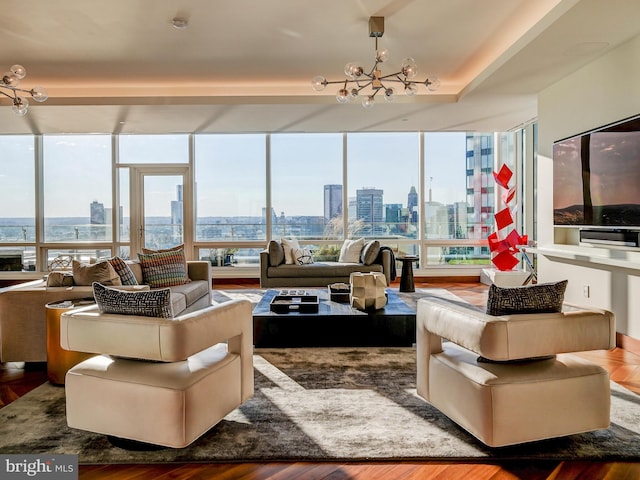 living room featuring a chandelier and hardwood / wood-style flooring