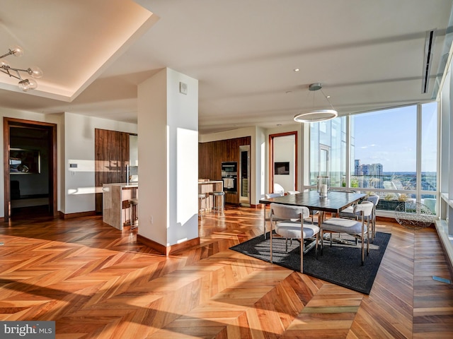 dining area with dark parquet flooring