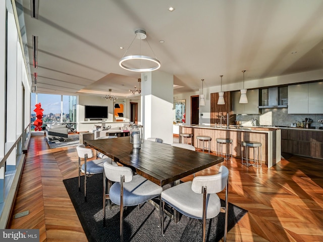 dining room featuring dark parquet flooring