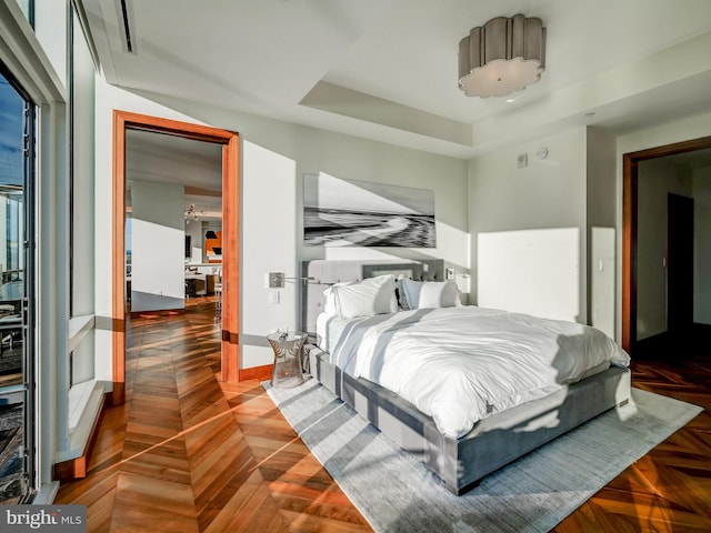 bedroom featuring dark parquet floors