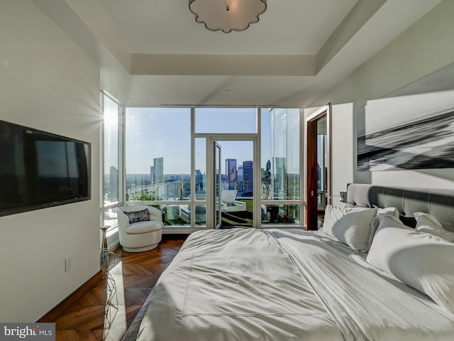 bedroom featuring dark parquet flooring