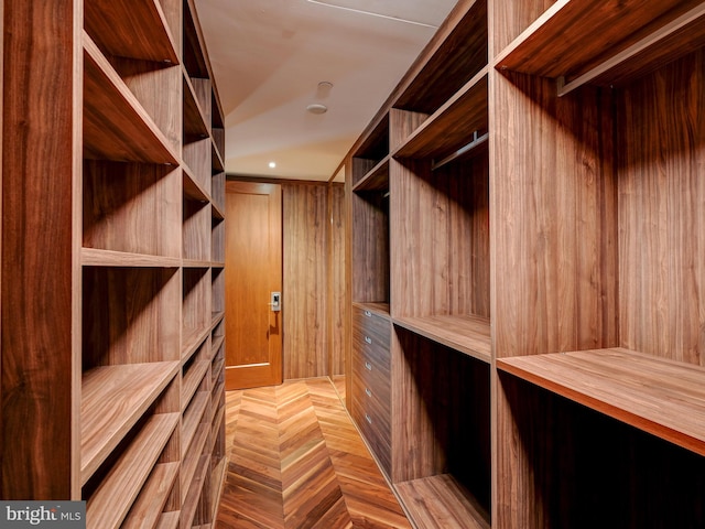 walk in closet featuring light parquet floors