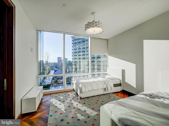 bedroom featuring dark parquet floors