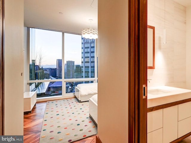 interior space with sink and parquet flooring