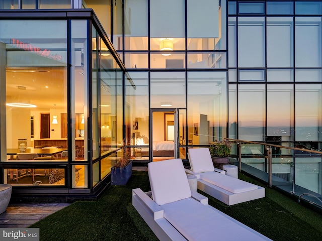 view of patio featuring a balcony