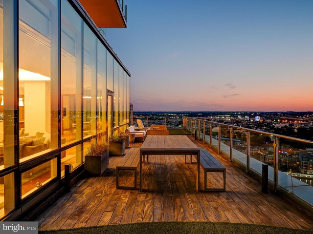 view of balcony at dusk