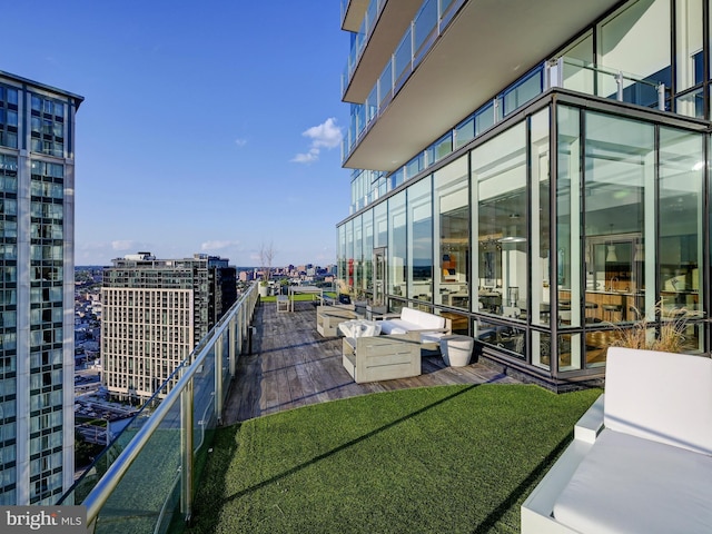 balcony with a patio area and an outdoor hangout area